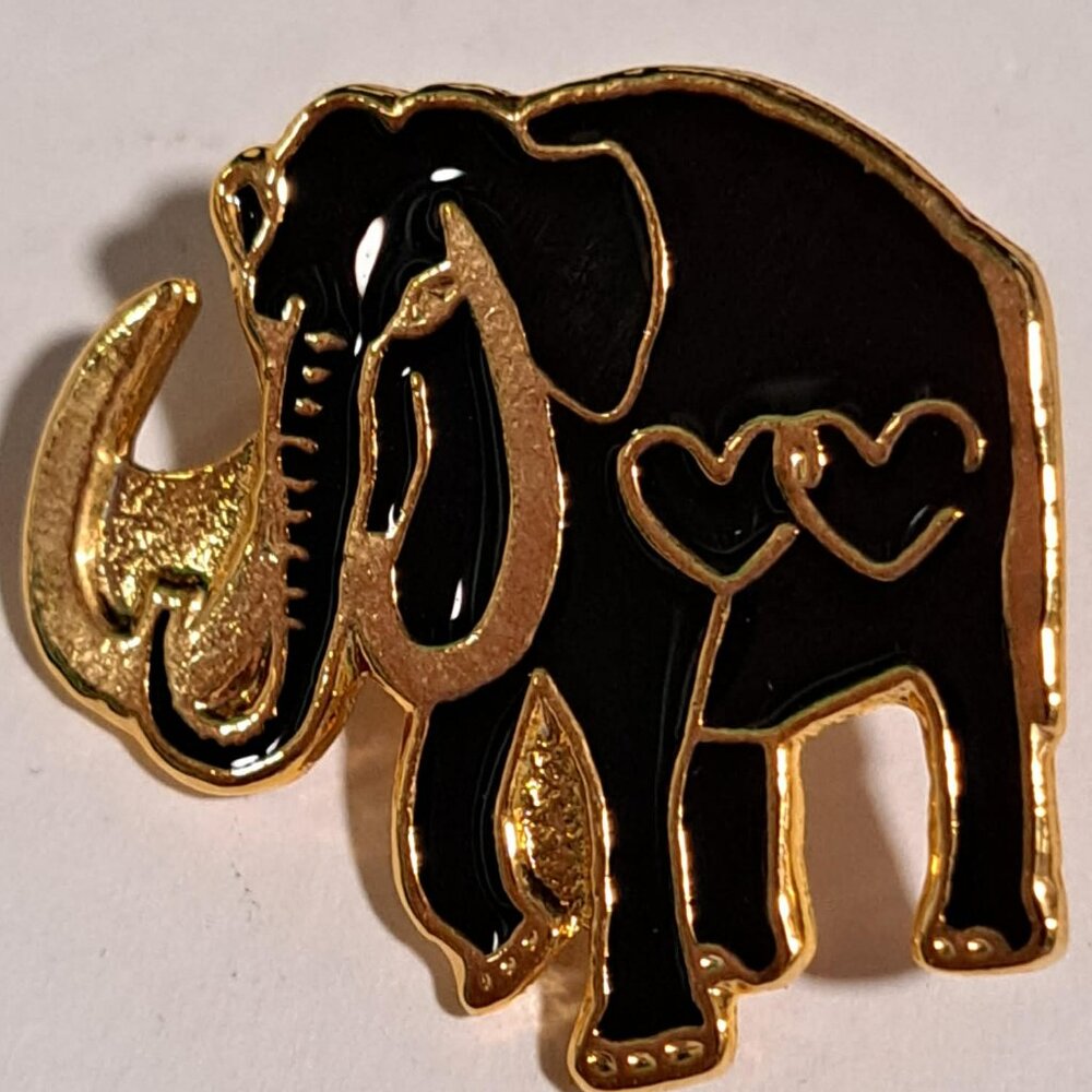 black and gold colored elephant with 2 hearts metal pin